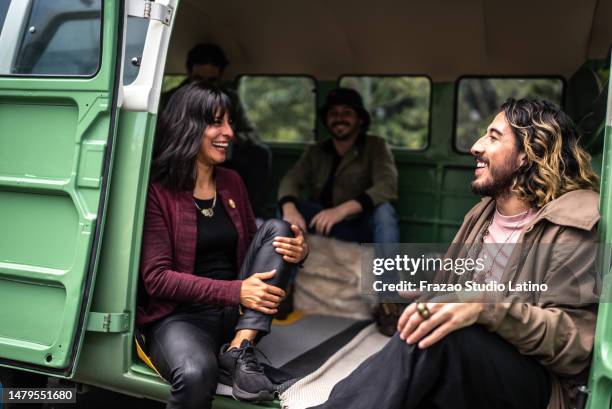 friends talking on a road trip in a retro mini van - camp gay venture imagens e fotografias de stock