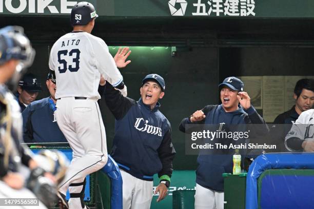 Aito Takeda of the Saitama Seibu Lions celebrates with head coach Kazuo Matsui after hitting a solo home run in the seventh inning against Orix...