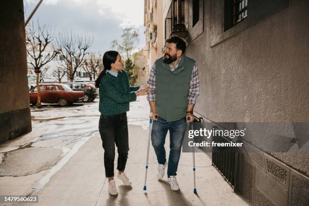 friends talking - crutch stock pictures, royalty-free photos & images