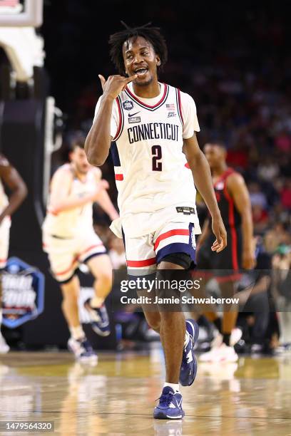 Tristen Newton of the Connecticut Huskies reacts after a play in the first half of the NCAA Men's Basketball Tournament National Championship game...