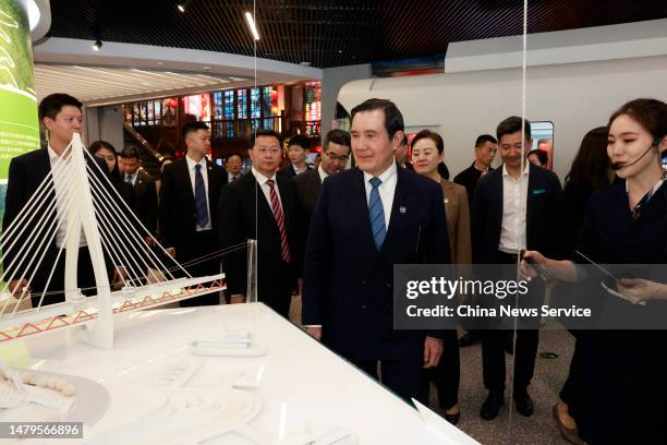 Ma Ying-jeou, former chairman of the Chinese Kuomintang party, views a bridge model while visiting Chongqing Planning Exhibition Hall on April 3,...