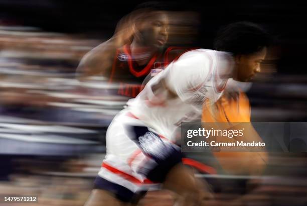 Tristen Newton of the Connecticut Huskies dribbles the ball during the second half against the San Diego State Aztecs during the NCAA Men's...