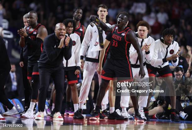 Aguek Arop of the San Diego State Aztecs and teammates react during the second half against the Connecticut Huskies during the NCAA Men's Basketball...