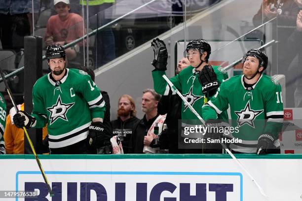 Jason Robertson the Dallas Stars acknowledges the crowd during a tribute celebrating his 100th point of the season during the third period against...