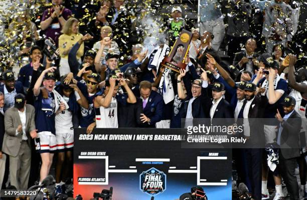 The Connecticut Huskies celebrate with the championship trophy after defeating the San Diego State Aztecs 76-59 during the NCAA Men's Basketball...