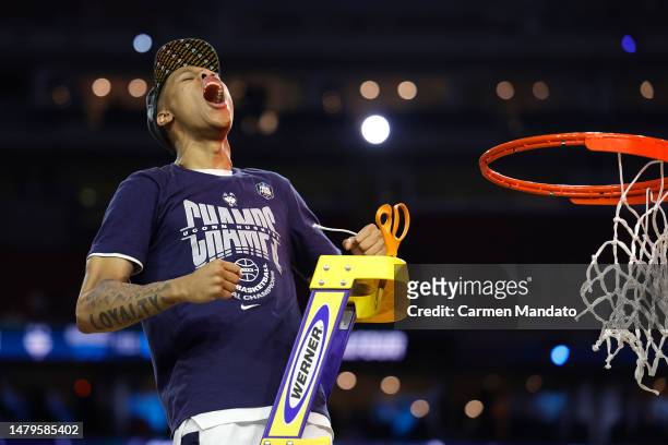 Jordan Hawkins of the Connecticut Huskies celebrates as he cuts down the net after defeating the San Diego State Aztecs 76-59 during the NCAA Men's...