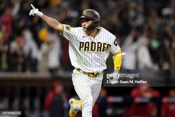 Ha-Seong Kim of the San Diego Padres reacts after hitting a walk-off homerun during the ninth inning of a game against the Arizona Diamondbacks at...