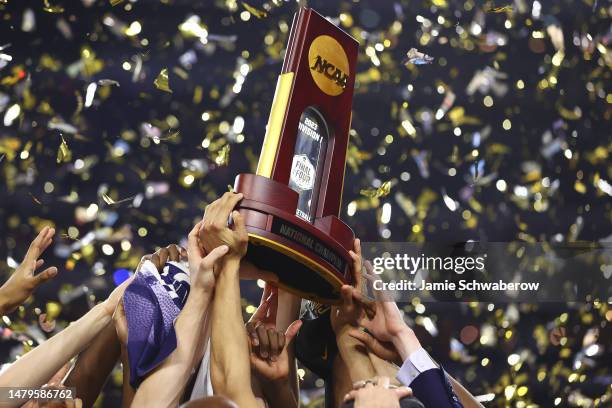 The Connecticut Huskies celebrate after defeating the San Diego State Aztecs to win the NCAA Men's Basketball Tournament National Championship at NRG...