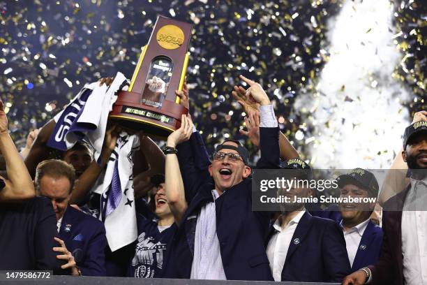 Head coach Dan Hurley of the Connecticut Huskies celebrates with the trophy after defeating the San Diego State Aztecs to win the NCAA Men's...