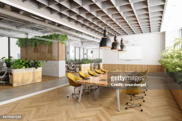 eco-friendly open space moderno interno ufficio con sala riunioni. tavolo da riunione in legno, sedie gialle, piante e pavimento in parquet - vuoto foto e immagini stock