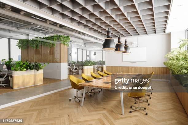 eco-friendly open plan modern office interior with meeting room. wooden meeting table, yellow chairs, plants and parquet floor - large office stock pictures, royalty-free photos & images