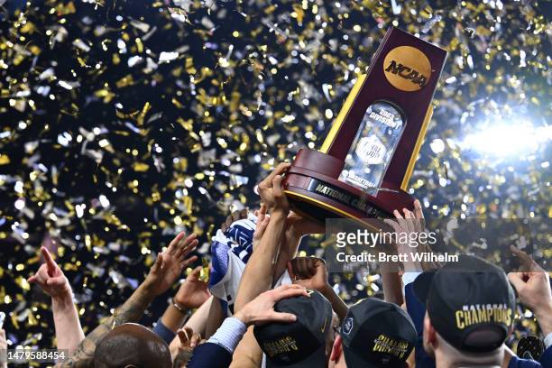 The Connecticut Huskies celebrate with the trophy after defeating the San Diego State Aztecs to win the NCAA Men's Basketball Tournament National...
