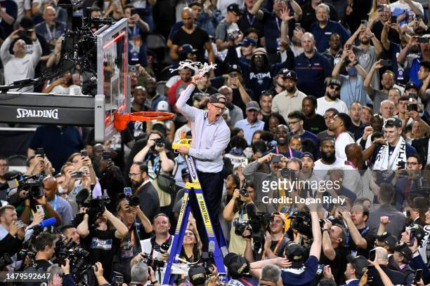Head coach Dan Hurley of the Connecticut Huskies reacts as he cuts down the net after defeating the San Diego State Aztecs 76-59 during the NCAA...
