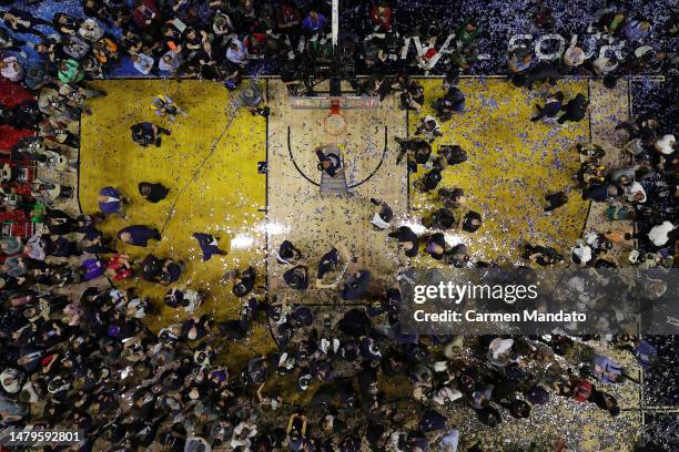 Jordan Hawkins of the Connecticut Huskies celebrates as he cuts down the net after defeating the San Diego State Aztecs 76-59 during the NCAA Men's...