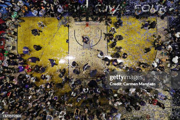 Jordan Hawkins of the Connecticut Huskies celebrates as he cuts down the net after defeating the San Diego State Aztecs 76-59 during the NCAA Men's...