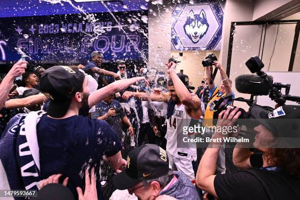Andre Jackson Jr. #44 of the Connecticut Huskies celebrates in the locker room after defeating the San Diego State Aztecs to win the NCAA Men's...
