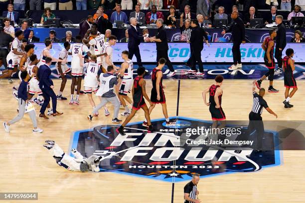 The Connecticut Huskies celebrate after defeating the San Diego State Aztecs to win the NCAA Men's Basketball Tournament National Championship at NRG...