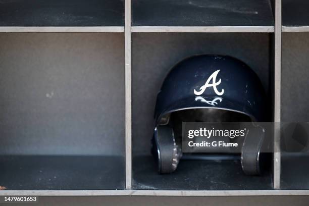 View of the Atlanta Braves batting helmet in the dugout before the game between the Washington Nationals and the Atlanta Braves at Nationals Park on...