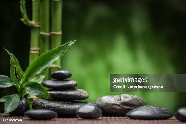 spa black stones and bamboo - feng shui stock pictures, royalty-free photos & images