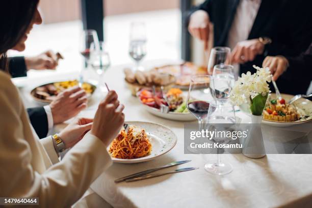 the business lunch is in progress - fine italian dining stock pictures, royalty-free photos & images