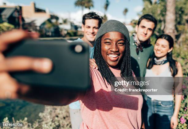 friends doing a selfie on the venice canals - venice california stock pictures, royalty-free photos & images