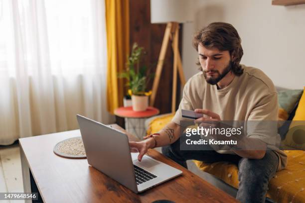 bearded man having problem with credit card, checking balance, loss money, internet fraud and scam concept - system failure stock pictures, royalty-free photos & images