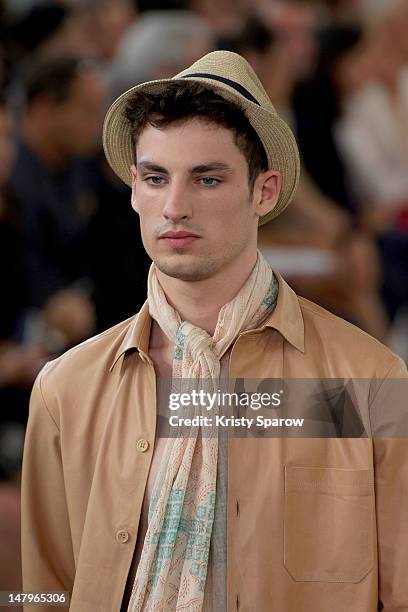 Model walks the runway during the Agnes B Menswear Spring / Summer 2013 show as part of Paris Fashion Week at Maison des Metallos on July 1, 2012 in...