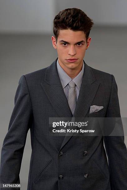 Model walks the runway during the Agnes B Menswear Spring / Summer 2013 show as part of Paris Fashion Week at Maison des Metallos on July 1, 2012 in...