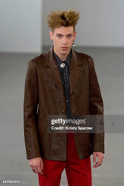 Model walks the runway during the Agnes B Menswear Spring / Summer 2013 show as part of Paris Fashion Week at Maison des Metallos on July 1, 2012 in...