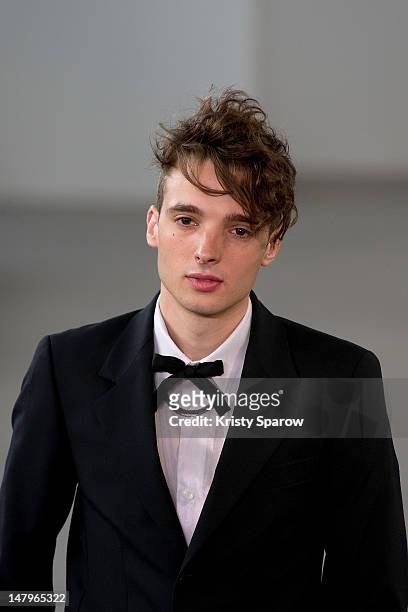 Model walks the runway during the Agnes B Menswear Spring / Summer 2013 show as part of Paris Fashion Week at Maison des Metallos on July 1, 2012 in...