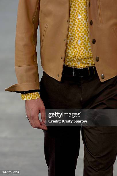 Model walks the runway during the Agnes B Menswear Spring / Summer 2013 show as part of Paris Fashion Week at Maison des Metallos on July 1, 2012 in...