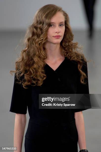 Model walks the runway during the Agnes B Menswear Spring / Summer 2013 show as part of Paris Fashion Week at Maison des Metallos on July 1, 2012 in...