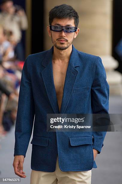 Model walks the runway during the Pierre Cardin Menswear Spring / Summer 2013 show as part of Paris Fashion Week at Palais Brongniart on July 1, 2012...