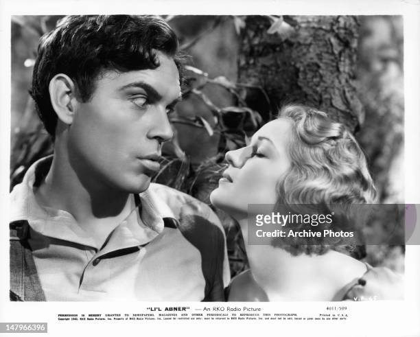 Stunned Jeff York looking at puckering Martha O'Driscoll in a scene from the film 'Li'l Abner', 1940.
