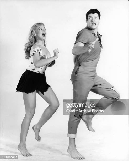 Edie Adams chasing after Peter Palmer in publicity portrait for the Broadway play 'Li'l Abner', 1956.