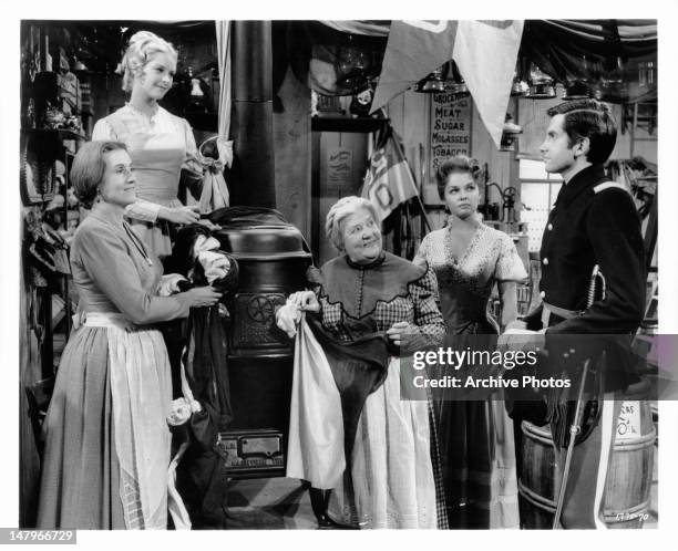 Irene Tedrow, Carole Wells, Marjorie Bennett, Luana Patten, and George Hamilton discuss gala dinner party in a scene from the film 'A Thunder Of...