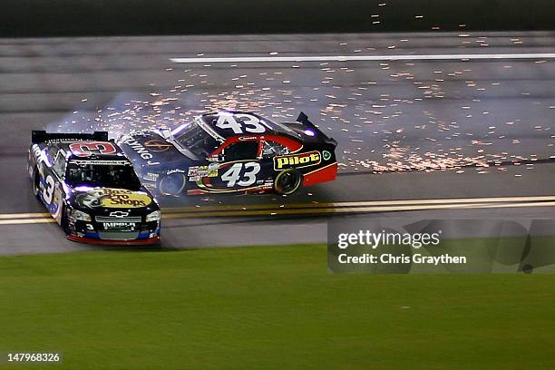 Austin Dillon, driver of the Bass Pro Shops/NRA Museum Chevrolet, spins out ahead of Michael Annett, driver of the Pilot Flying J Ford, on the front...