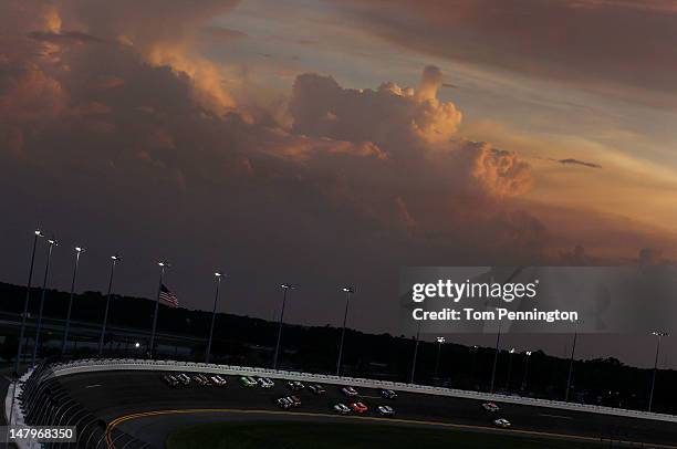 General view of cars race as the sun sets during the NASCAR Nationwide Series Subway Jalapeno 250 Powered by Coca-Cola at Daytona International...