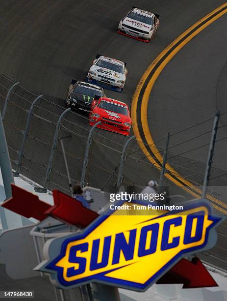 Kurt Busch, driver of the HendrickCars.com Chevrolet, leads Kyle Busch, driver of the Monster Energy Toyota, Danica Patrick, driver of the...