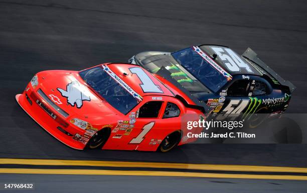 Kurt Busch, driver of the HendrickCars.com Chevrolet, leads Kyle Busch, driver of the Monster Energy Toyota, during the NASCAR Nationwide Series...