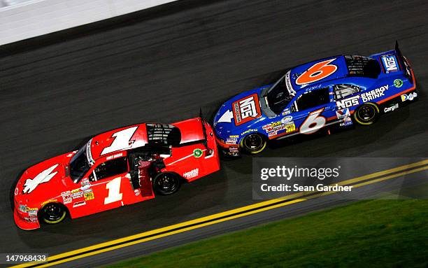 Kurt Busch, driver of the HendrickCars.com Chevrolet, leads Ricky Stenhouse Jr., driver of the NOS Energy Drink Ford, in the last lap in turn 3...