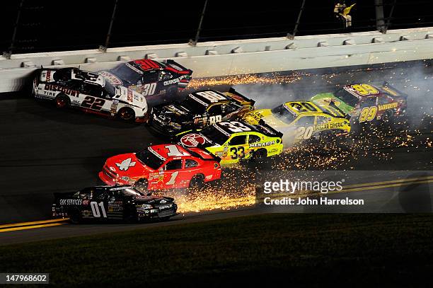 Mike Wallace, driver of the G&K Services Chevrolet, spins during the NASCAR Nationwide Series Subway Jalapeno 250 Powered by Coca-Cola at Daytona...