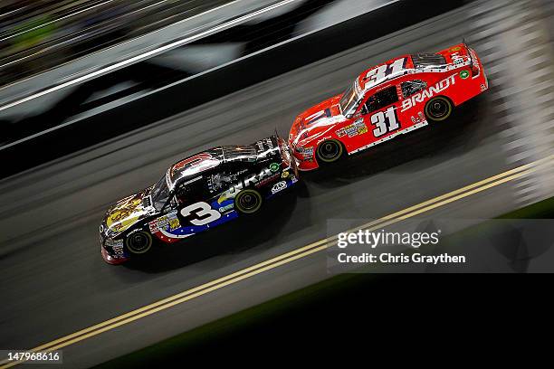 Austin Dillon, driver of the Bass Pro Shops/NRA Museum Chevrolet, leads Justin Allgaier, driver of the Brandt Chevrolet, during the NASCAR Nationwide...