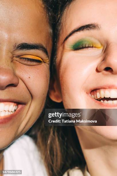 two young beautiful women with bright make-up close-up. diversity concept. - paleta de maquilhagem imagens e fotografias de stock