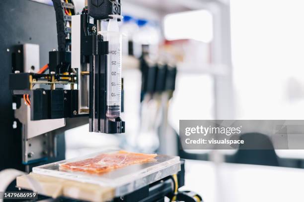 scientist setting up bio-ink printer - 3d printing stock pictures, royalty-free photos & images