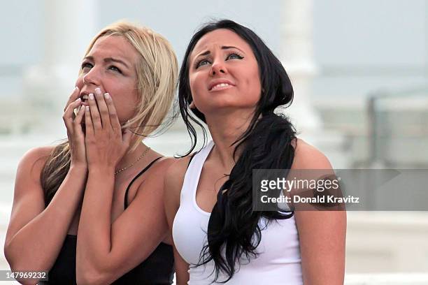 Jackie Bianchi and Olivia Blois Sharpe performs on trapeze at Trump Taj Mahal on July 6, 2012 in Atlantic City, New Jersey.