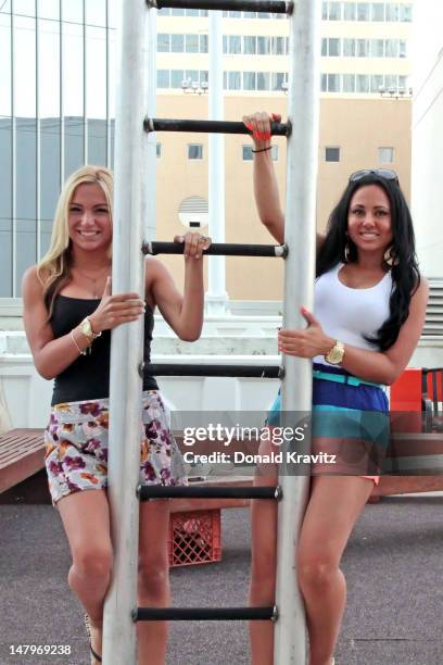 Jackie Bianchi and Olivia Blois Sharpe performs on trapeze at Trump Taj Mahal on July 6, 2012 in Atlantic City, New Jersey.