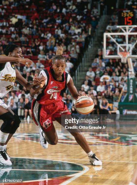 Cynthia Cooper, Guard for the Houston Comets in motion dribbling the basketball during the WNBA Western Conference basketball game against the...