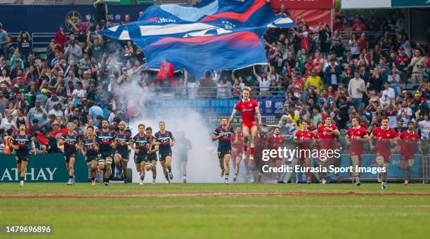 April 2: Team Hong Kong and Team Canada walk to the field during the Hong Kong Sevens at Hong Kong Stadium on April 2, 2023 in Hong Kong, China.