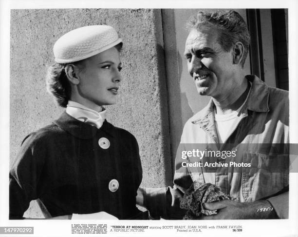 Joan Vohs looking at a smiling Frank Faylen in a scene from the film 'Terror At Midnight', 1956.